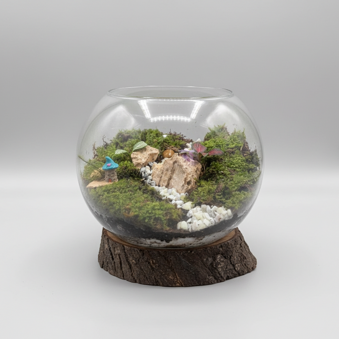 A large bowl terrarium with a moss garden mimicking a green pasture